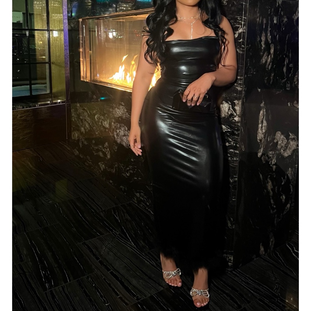 Black vegan leather dress with feathers on bottom